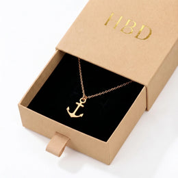 Collana e bracciale con ciondolo a ancora