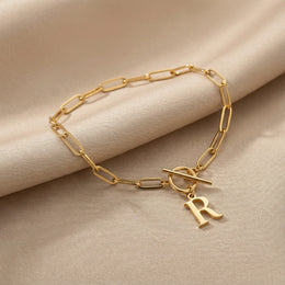 Initial Bracelet with Oval Belcher T-bar Chain & Multiple Charms in Gold or Silver