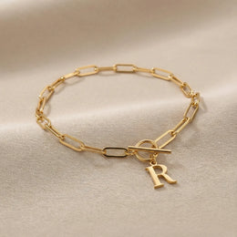 Initial Bracelet with Oval Belcher T-bar Chain & Multiple Charms in Gold or Silver