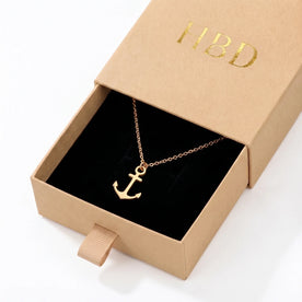 Collana e bracciale con ciondolo a ancora