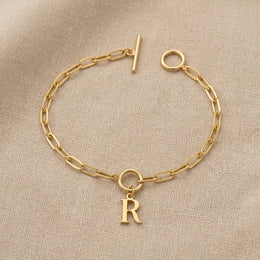 Initial Bracelet with Oval Belcher T-bar Chain & Multiple Charms in Gold or Silver