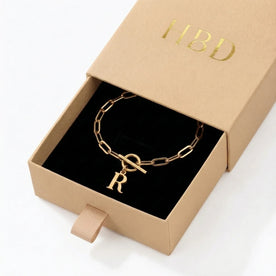 Initial Bracelet with Oval Belcher T-bar Chain & Multiple Charms in Gold or Silver