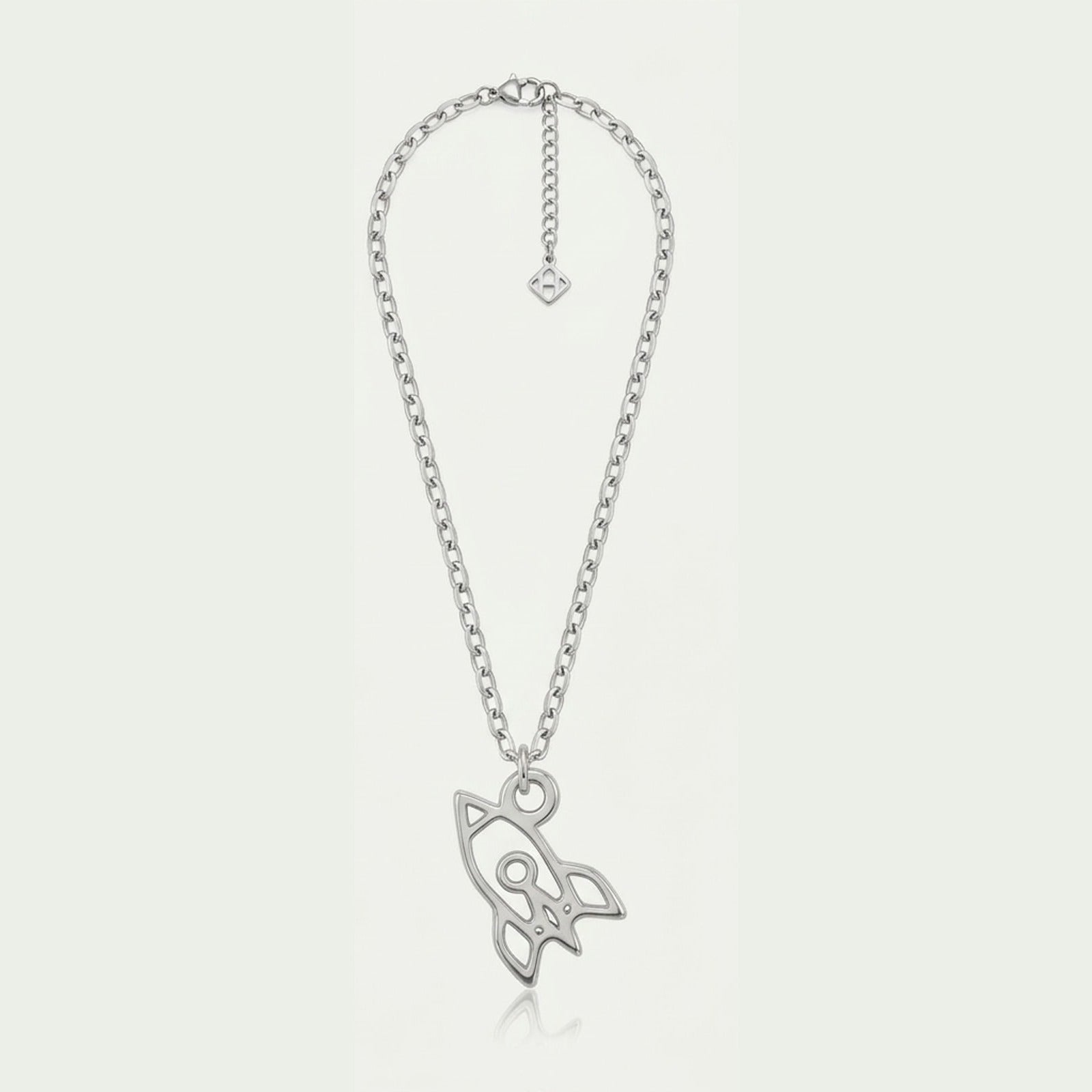 A single silver space rocket charm necklace on a anchor chain, the charm hanging from a round jump ring through its own loop