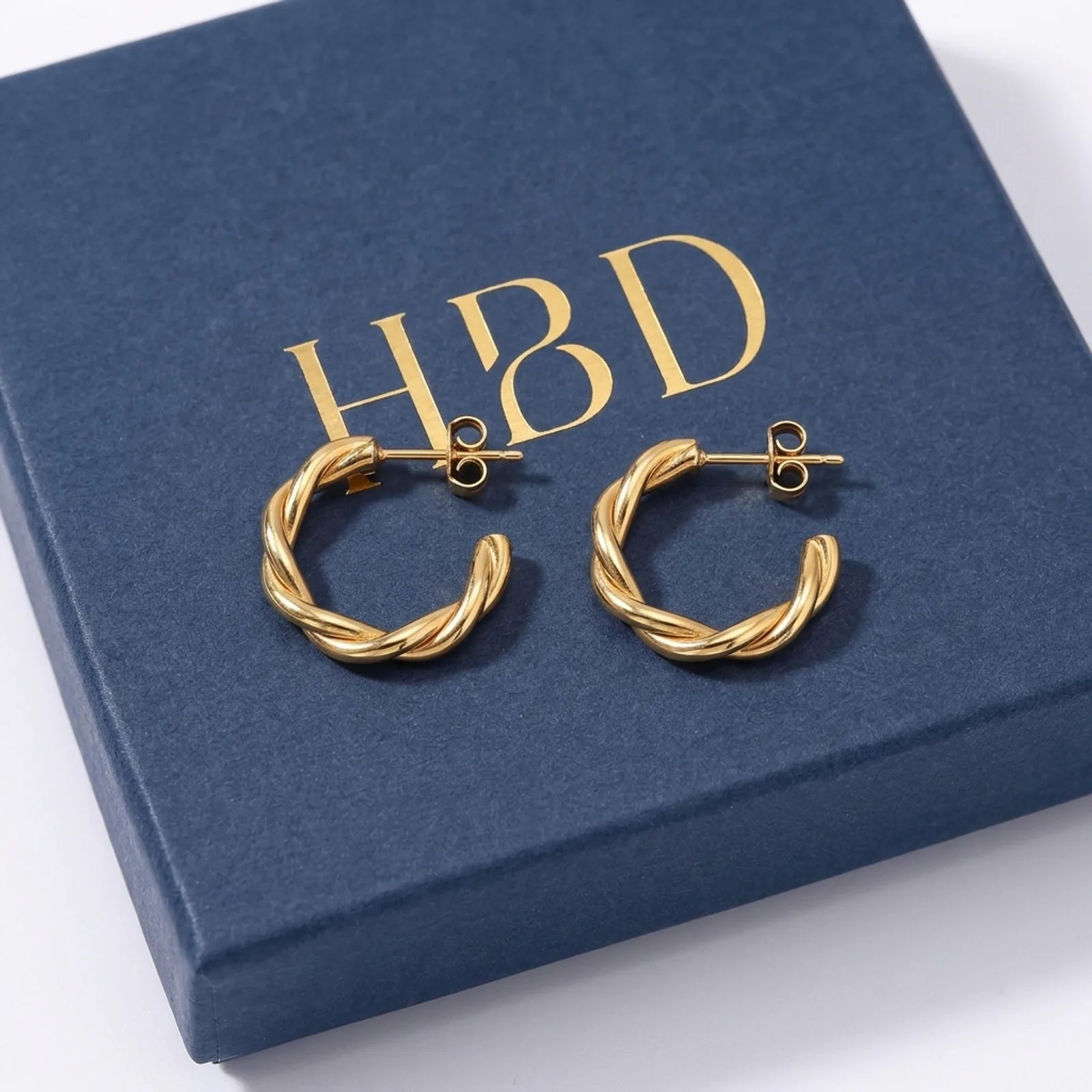 Twisted Hoop Stud Earrings – Sculptural Modern Hoops for Everyday Wear